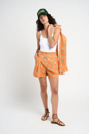 Short Nils orange à motifs coquillages
